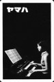 Yamaha-piano-on-black-retro